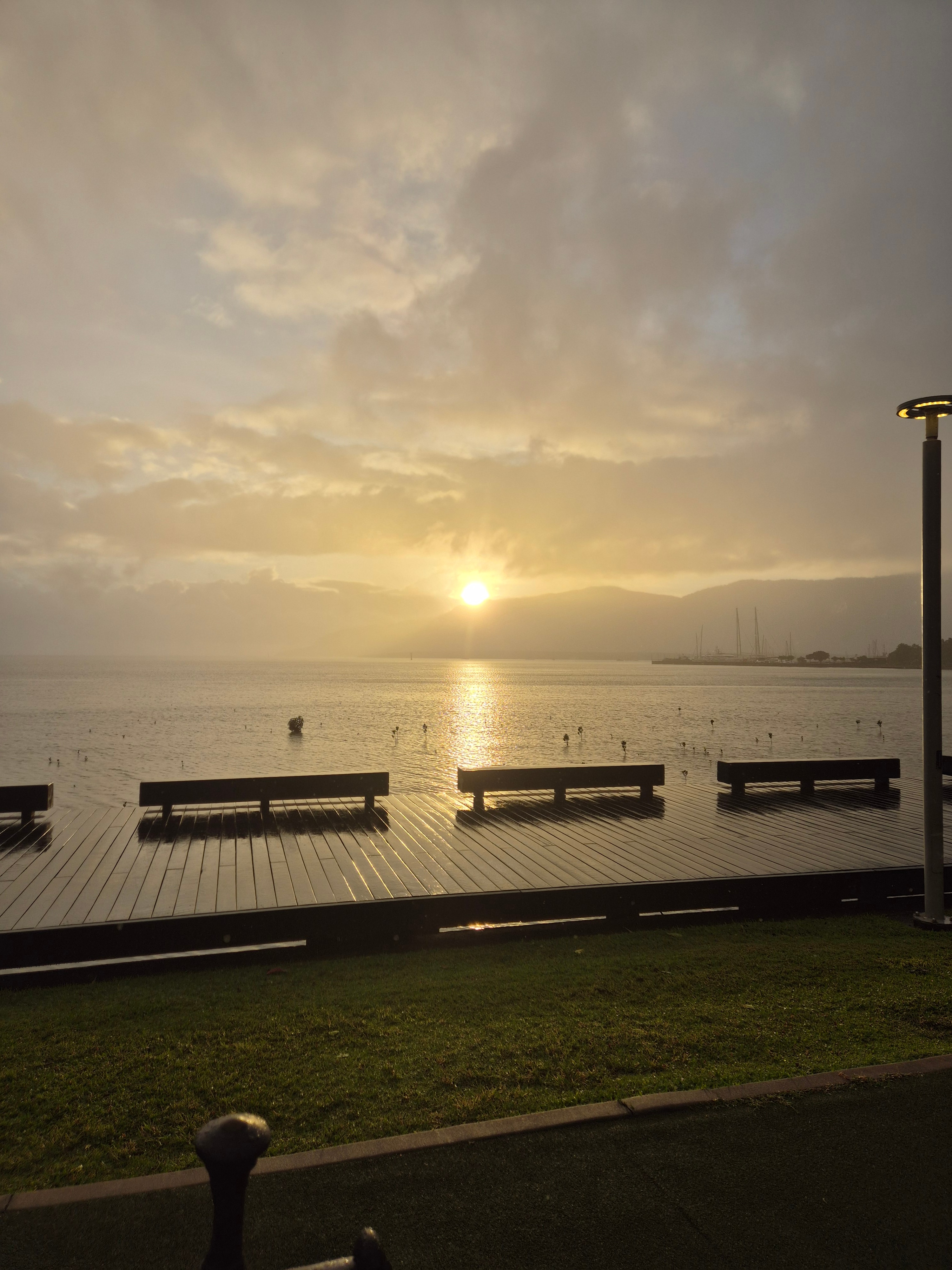 Stunning sunrise over Cairns Esplanade showcasing the beautiful tropical North Queensland landscape where HansenDev provides web development and AI integration services